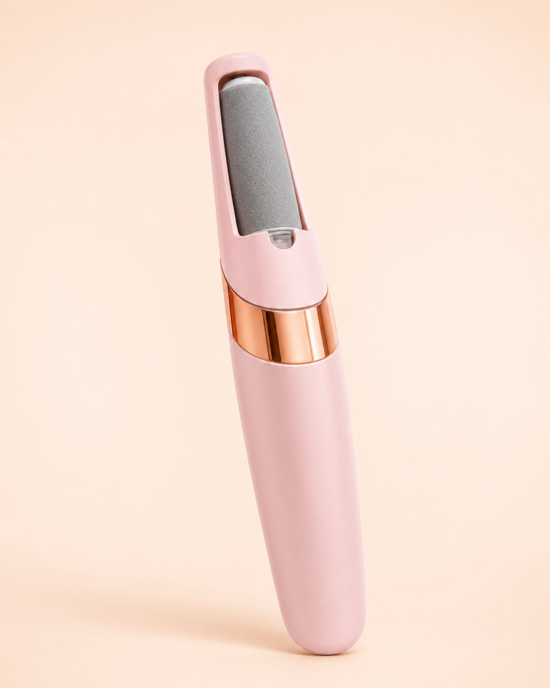 Pink Pediore electric callus remover on an ivory studio background